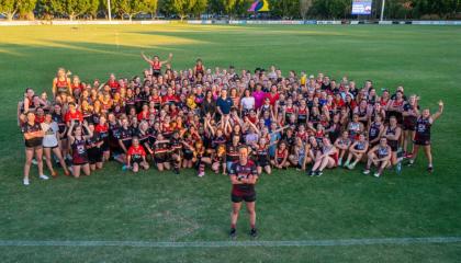 Kahla in front of the Morningside Panthers AFL Club.