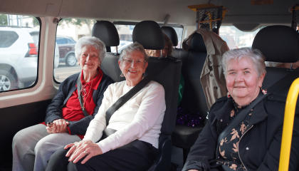 Elderly women sitting in the community transport bus